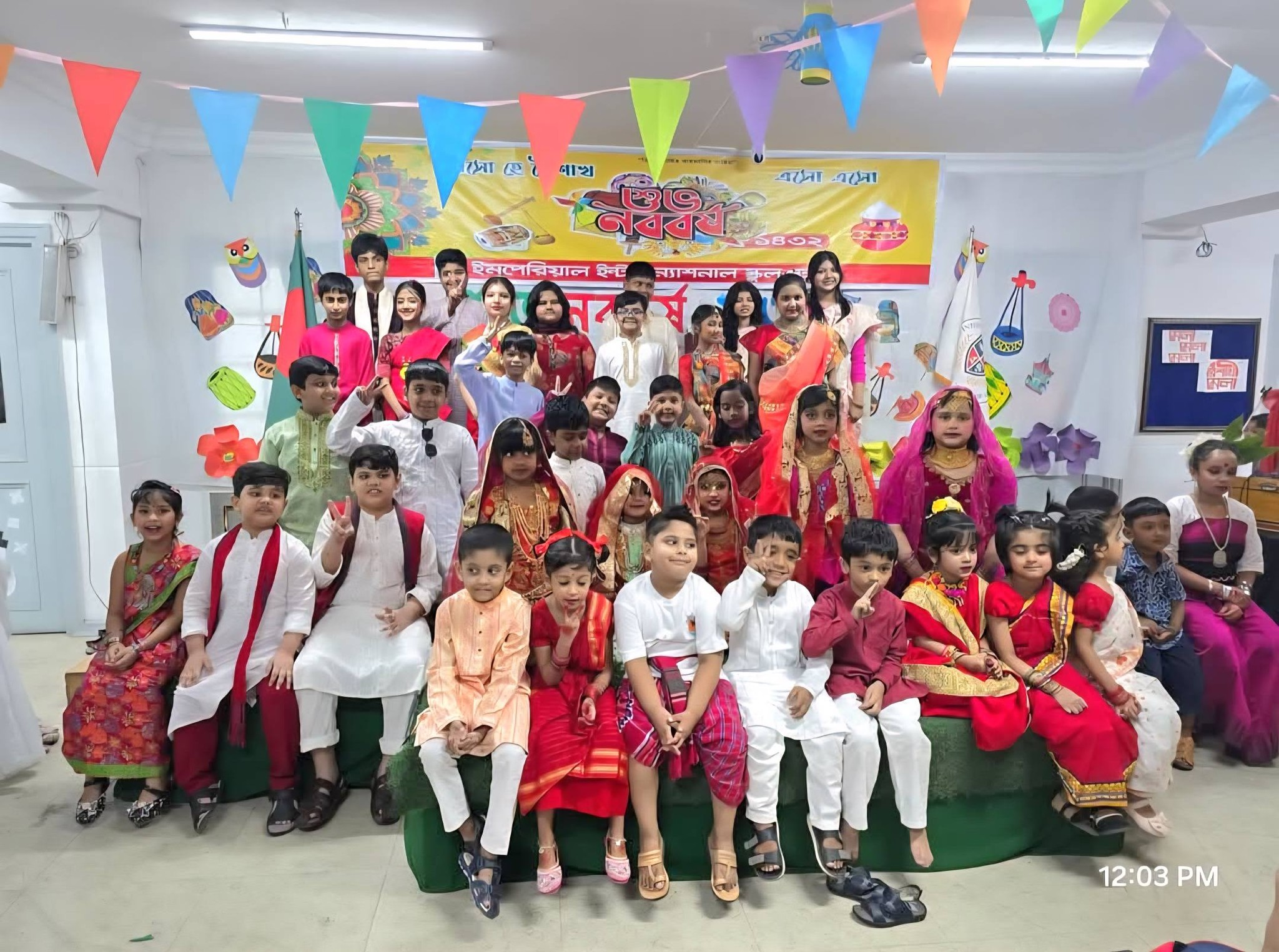 Students in traditional attire for Pohela Boishakh celebration
